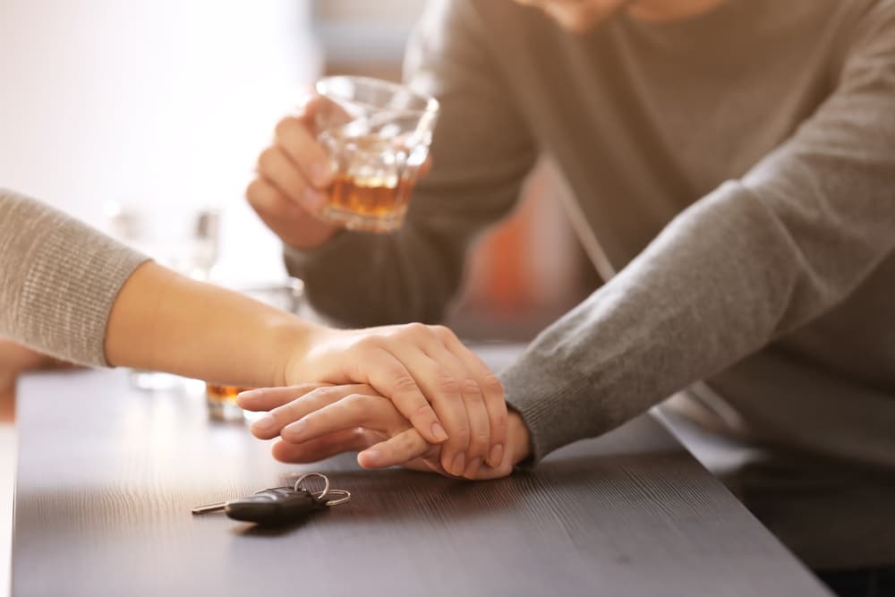 Person stopping someone from grabbing keys in an attempt to drive under the influence