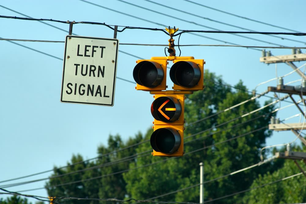 left turn signal light showing when it is legal to make a turn
